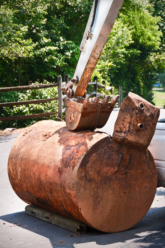 an old, rusted underground storage tank removed for safety purposes